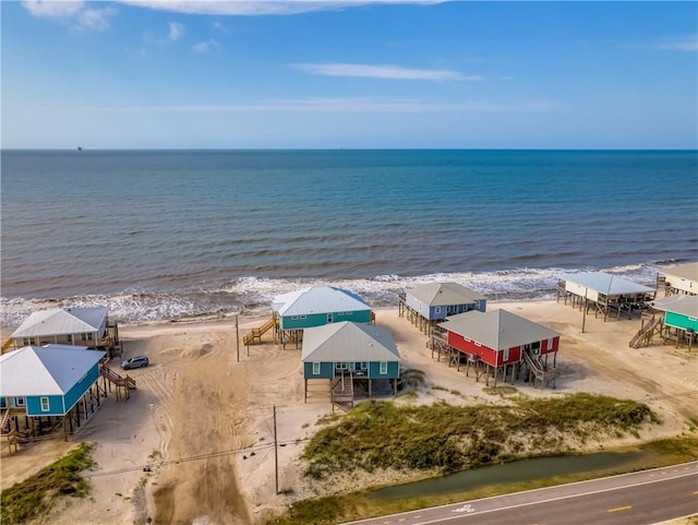 drone / aerial view featuring a view of the beach and a water view