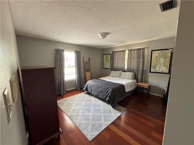5911 Shenandoah Rd N, Mobile, AL 36608 - bedroom featuring wood finished floors and a textured ceiling
