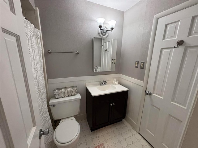 5911 Shenandoah Rd N, Mobile, AL 36608 - full bath with wainscoting, vanity, and tile patterned floors