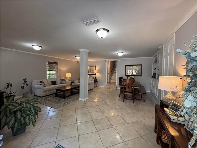 5911 Shenandoah Rd N, Mobile, AL 36608 - living area with stairs, crown molding, light tile patterned floors, and decorative columns