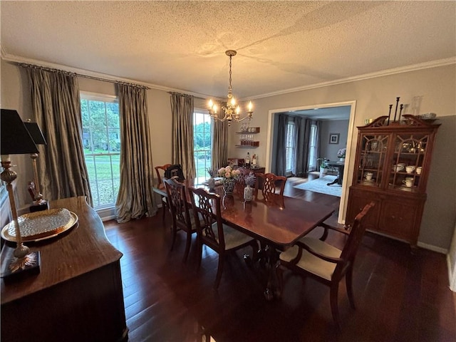 5911 Shenandoah Rd N, Mobile, AL 36608 - dining room featuring a chandelier, a textured ceiling, dark wood-style floors, and crown molding