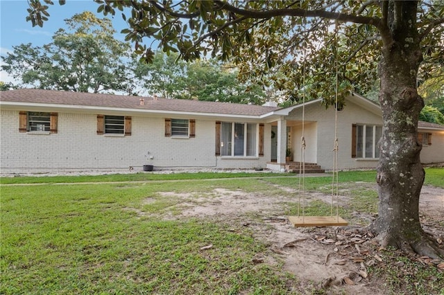 back of house with a yard