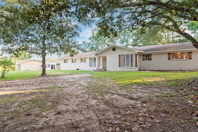 ranch-style house with a front yard