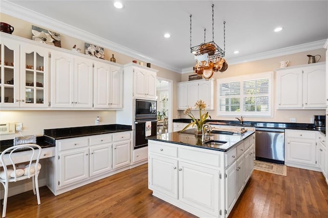 kitchen with white cabinets, black appliances, crown molding, and wood finished floors