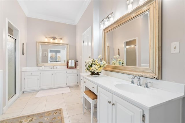 full bath featuring a stall shower, crown molding, a sink, and two vanities
