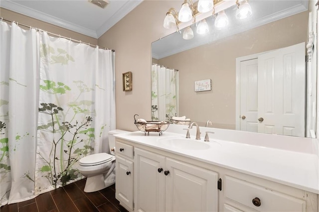 full bathroom with wood finish floors, toilet, crown molding, and vanity