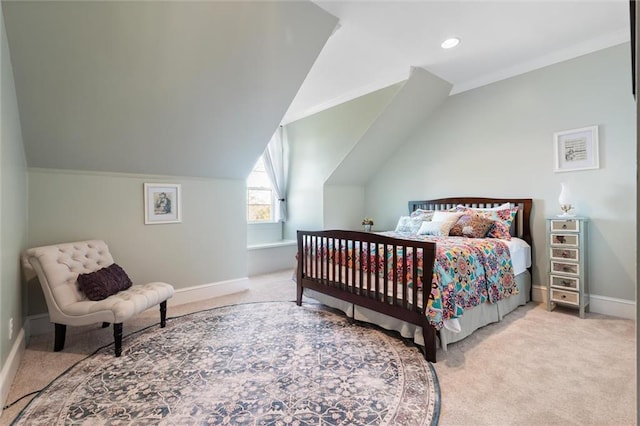 bedroom featuring baseboards, lofted ceiling, and carpet
