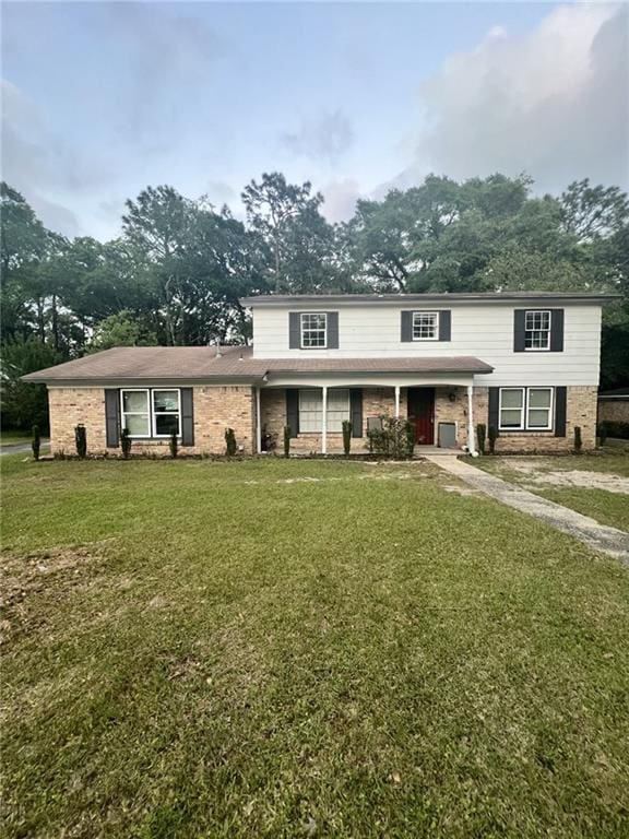 1122 Fribourg St, Mobile, AL 36608 - traditional-style home featuring a porch and a front yard