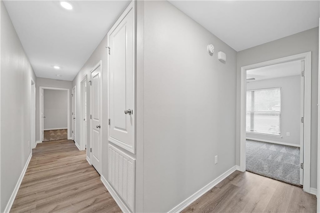 hall with light wood-type flooring