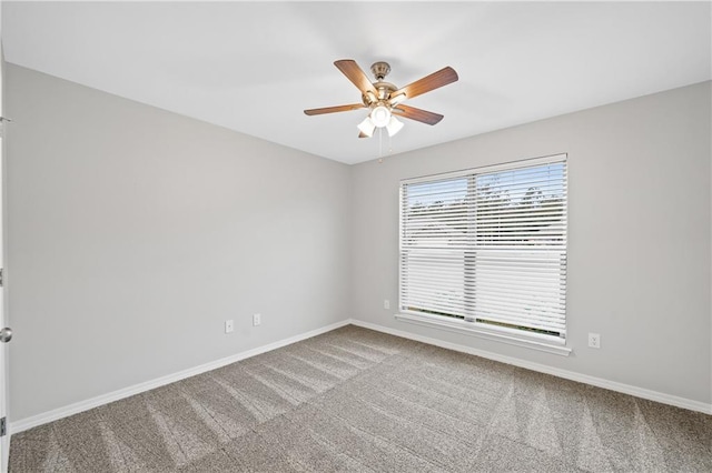 empty room with carpet floors and ceiling fan