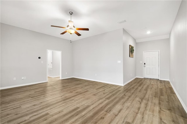 unfurnished room featuring ceiling fan and light hardwood / wood-style flooring