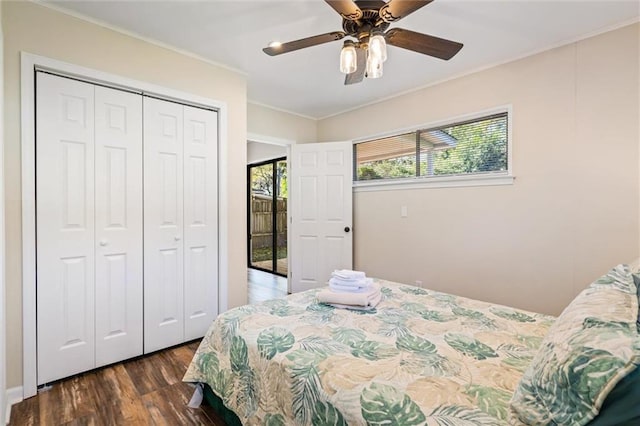 54 Bishop Ln, Mobile, AL 36608 - bedroom with dark wood-style flooring, a closet, crown molding, and a ceiling fan