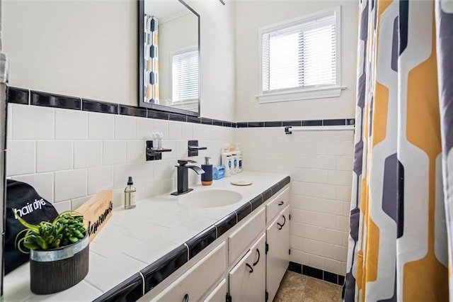 54 Bishop Ln, Mobile, AL 36608 - full bath featuring vanity, tile walls, and a wainscoted wall