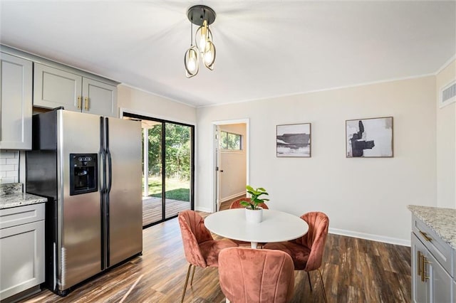 54 Bishop Ln, Mobile, AL 36608 - dining area with dark wood finished floors, baseboards, and ornamental molding