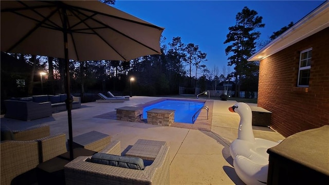 view of pool featuring a patio area, a fenced in pool, and an outdoor hangout area