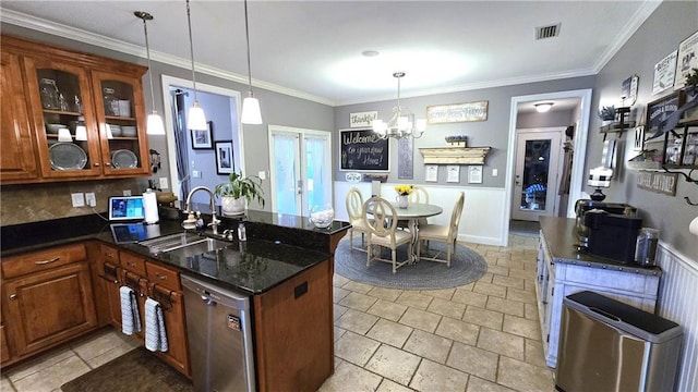 kitchen with a sink, brown cabinets, dishwasher, and a peninsula