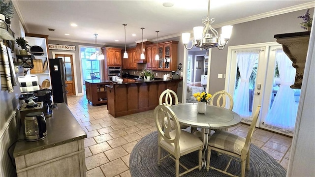 dining area featuring visible vents, ornamental molding, stone tile floors, recessed lighting, and a chandelier