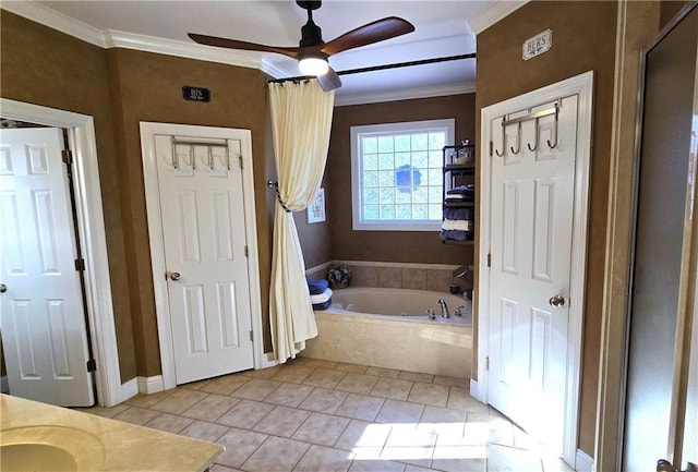 bathroom with tile patterned floors, a garden tub, ornamental molding, and ceiling fan