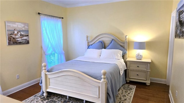 bedroom with baseboards, multiple windows, and dark wood-style floors