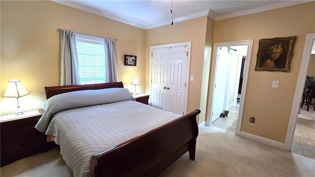 bedroom with a closet, light carpet, baseboards, and crown molding