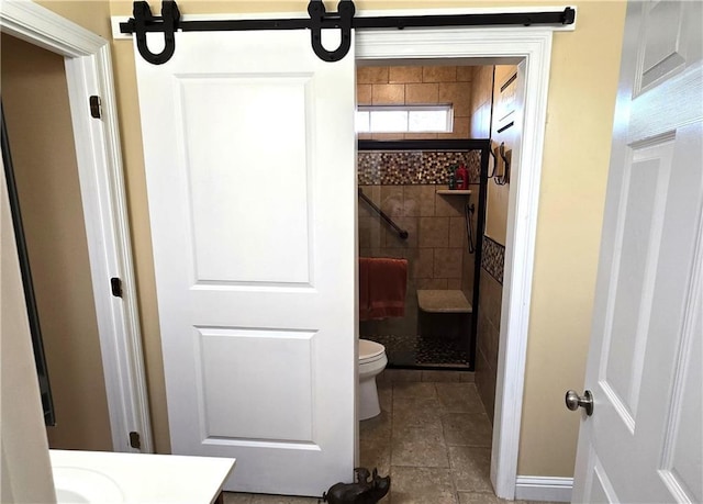 full bathroom with a stall shower, toilet, and vanity