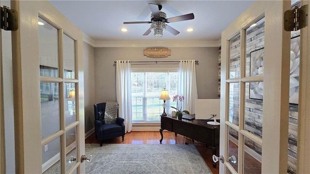 home office featuring french doors, crown molding, ceiling fan, and wood finished floors