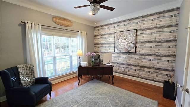 office space featuring ceiling fan, wood finished floors, baseboards, and ornamental molding