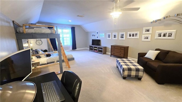 carpeted living room with baseboards, lofted ceiling, and a ceiling fan