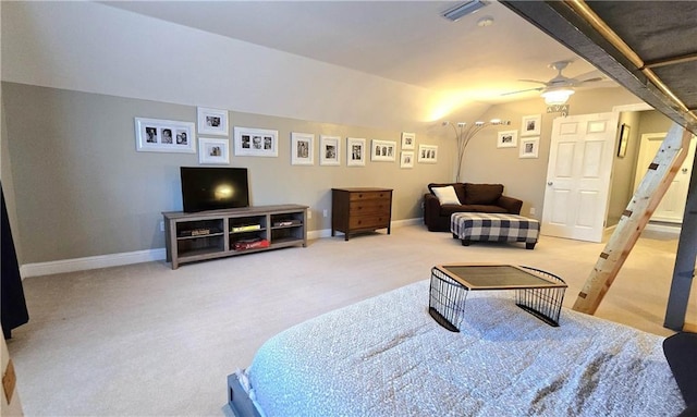 living room with carpet flooring, baseboards, lofted ceiling, and a ceiling fan