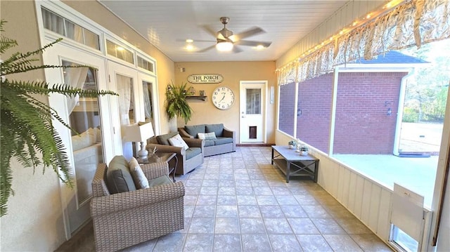 sunroom / solarium with french doors and ceiling fan