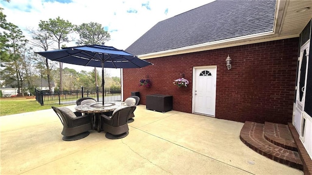 view of patio / terrace featuring outdoor dining area and fence