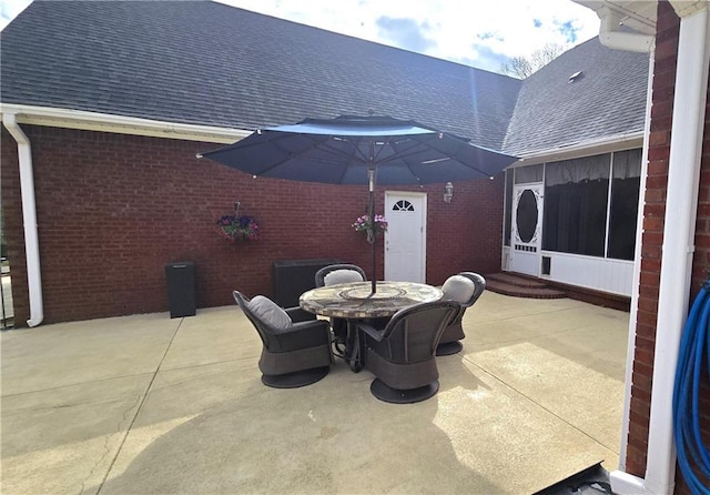 view of patio / terrace with a sunroom