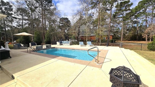 view of pool with an outdoor living space, fence, a fenced in pool, and a patio