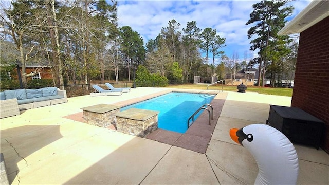 view of swimming pool featuring a fenced backyard, a fenced in pool, outdoor lounge area, and a patio