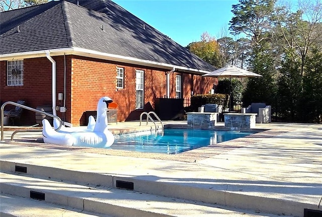 pool featuring a patio area