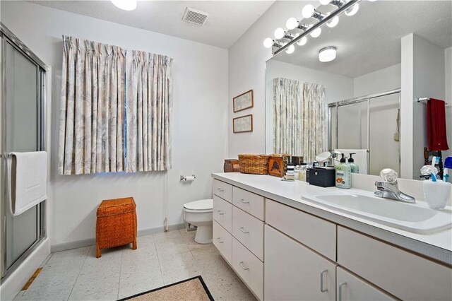 110 Schooley Cir, Daphne, AL 36526 - full bath featuring vanity, a shower stall, baseboards, and toilet