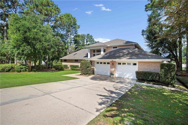 110 Schooley Cir, Daphne, AL 36526 - view of front of property featuring an attached garage, concrete driveway, a front yard, and brick siding
