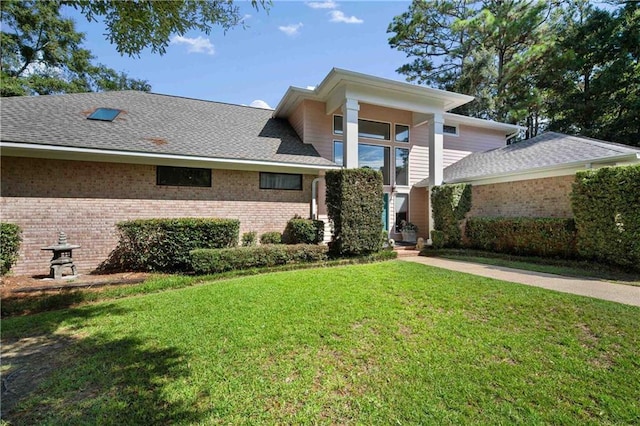 110 Schooley Cir, Daphne, AL 36526 - view of front of property with brick siding, a front lawn, and roof with shingles