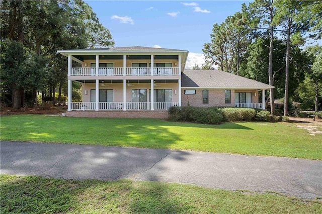 110 Schooley Cir, Daphne, AL 36526 - view of front facade featuring ceiling fan, a front yard, a balcony, and covered porch