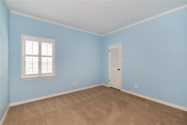 carpeted spare room with ornamental molding