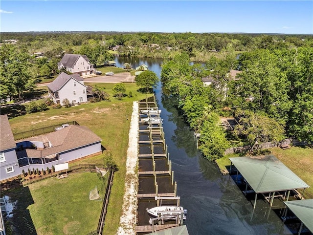 aerial view featuring a water view and a forest view