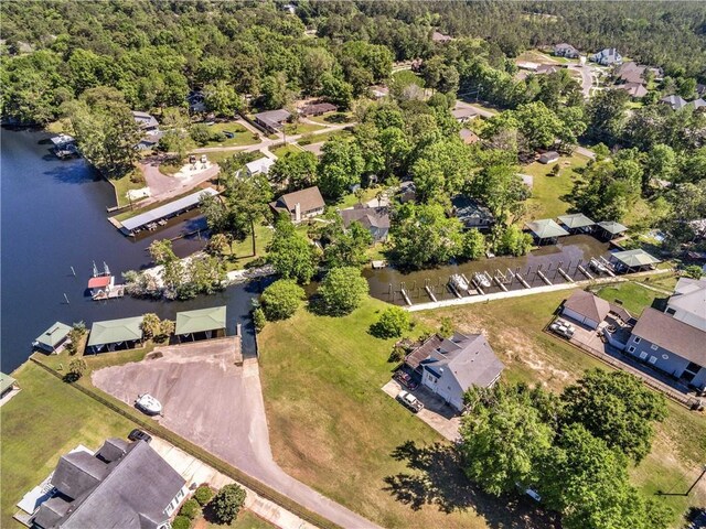 bird's eye view featuring a residential view, a view of trees, and a water view