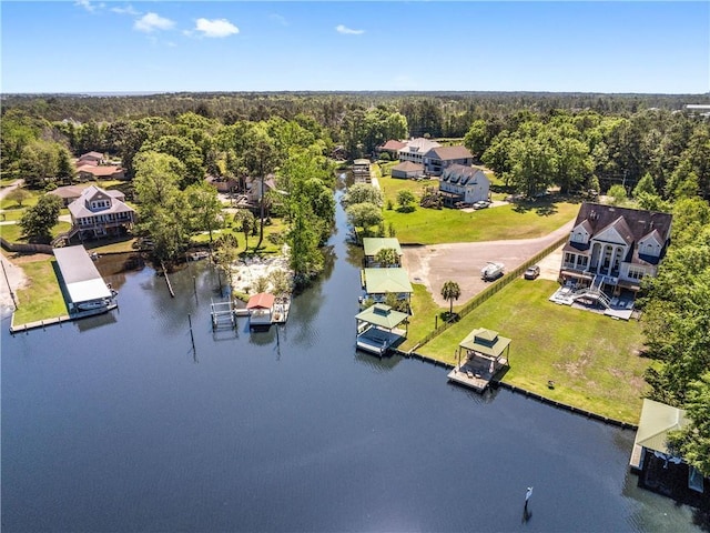 bird's eye view with a residential view, a water view, and a forest view