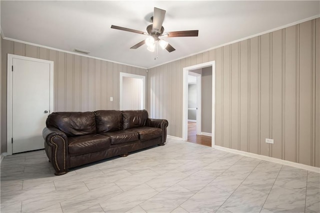 living area featuring marble finish floor, crown molding, visible vents, ceiling fan, and baseboards