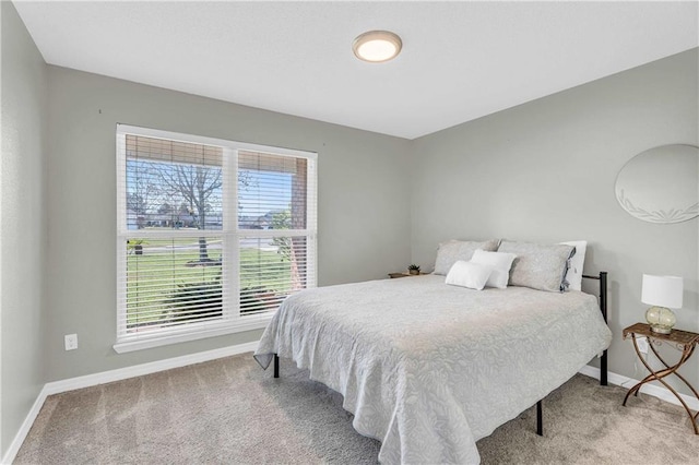 bedroom featuring baseboards and carpet floors