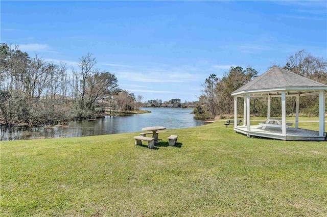 view of yard featuring a gazebo and a water view