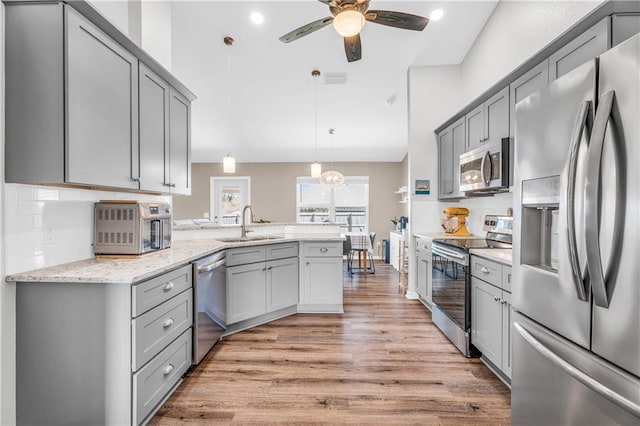 kitchen featuring gray cabinets and stainless steel appliances