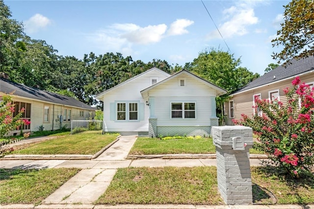 rear view of house with a yard