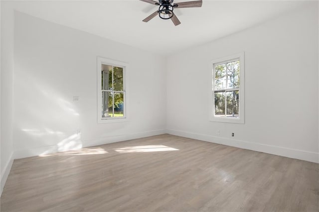 empty room featuring light hardwood / wood-style flooring and ceiling fan