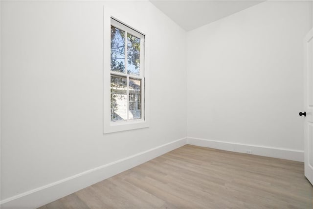 unfurnished room with light hardwood / wood-style floors